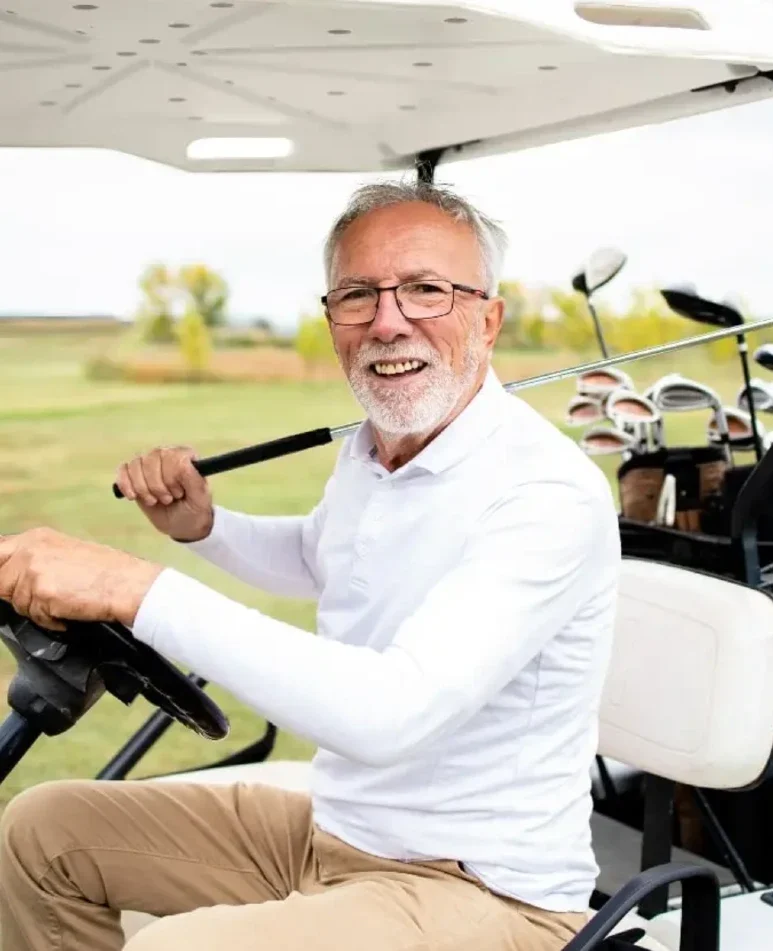 Man in golf buggy at mount gilead estate retirement village